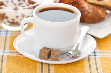 cup of coffee, fresh croissants and muesli