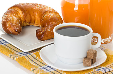 cup of coffee, fresh croissant and juice orange