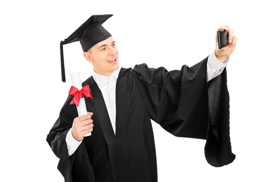 College graduate taking a selfie with phone