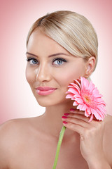 Tender woman with pink flower