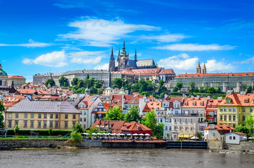 View of colorful old town and Prague castle with river