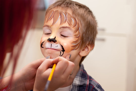 Portrait of a boy with painted face