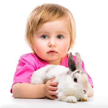 baby girl  with her small rabbits