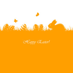 Easter eggs and rabbit on orange grass