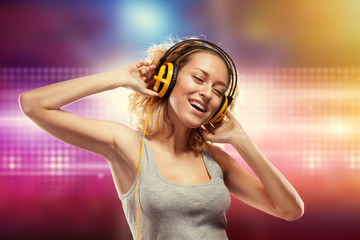 Beautiful woman with headphones listening music