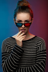 Girl in 3D glasses. Studio photography.