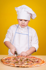 Boy making pizza