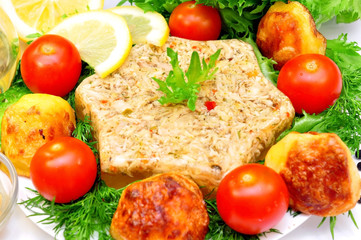 Aspic from meat with roasted potatoes and fresh vegetables