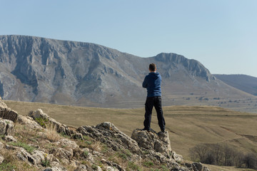 Man standing on top of mountain