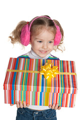 Cheerful little girl holds a gift box