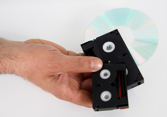 media storage old video cassettes tapes cd tape hand hold