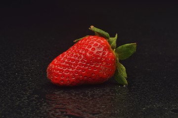 strawberries isolated on black background