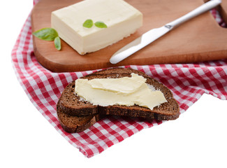 Slice of rye bread with butter, isolated on white