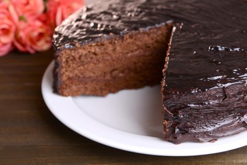 Delicious chocolate cake on table close-up