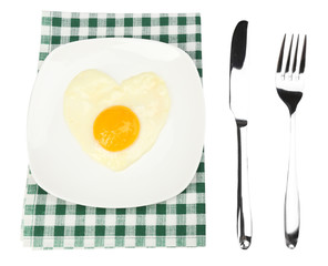 Scrambled eggs with bread on plate, on color napkin