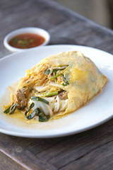 noodle and vegetable fried with egg in sun light