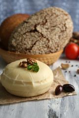 Tasty Italian cheese on wooden table