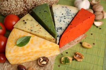 Different Italian cheese on wooden table