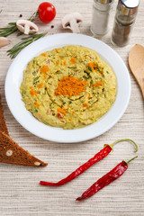 Bowl of tasty fresh hummus, close up