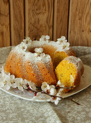 Cupcake decorated with flowers and a cup of coffee..