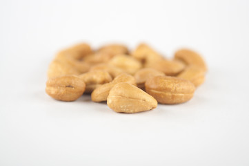 Roasted cashew nuts on white background