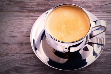 cup of Coffee on wooden vintage table