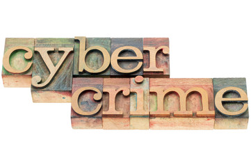 Fototapeta na wymiar cybercrime word in wood type