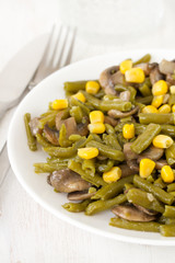 green beans with mushrooms and corn on plate