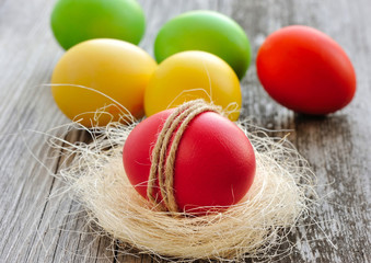 Colorful Easter eggs on a wooden table old