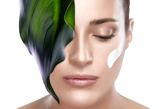 Beautiful Spa Girl with Leaf on Her Face. Skincare concept