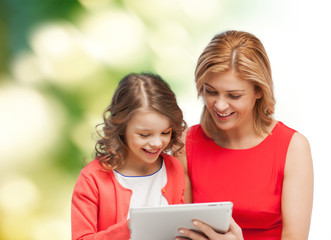 mother and daughter with tablet pc computer