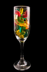 jelly candy and a wine glass on a dark background