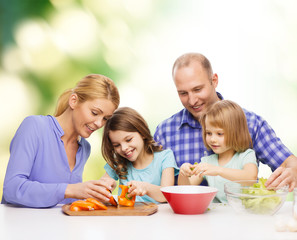 happy family with two kids making dinner at home