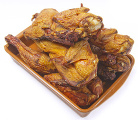 smoked chicken in a plate on white background