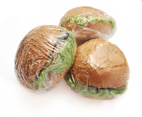 three hamburgers on a white background