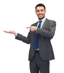 man showing something on the palm of his hand