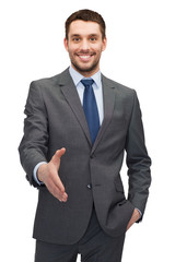buisnessman with open hand ready for handshake