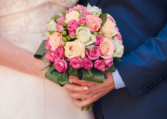 bride and the groom showing their rings