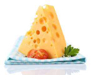 Piece of cheese and tomatoes,on color napkin, isolated on white