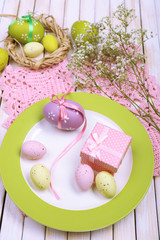 Easter table setting with tulips and eggs