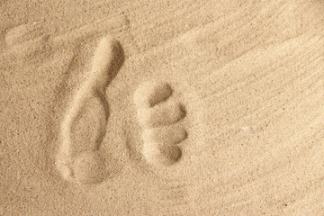 Hand prints in sand as nice summer background