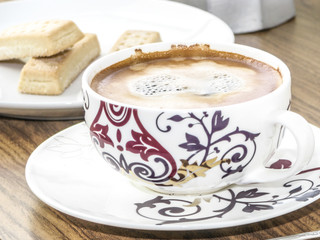 Coffee cup and biscuits
