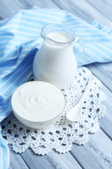 Dairy products on wooden table background