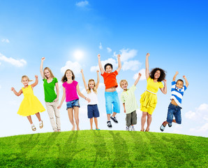 Obraz premium Cheerful Children and Women Raising Their Arms Outdoors