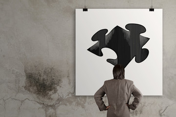 businessman looking at  Partnership Puzzle on poster as concept