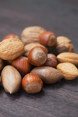 heap of nuts on a wooden surface