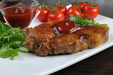 Pork steak with ketchup
