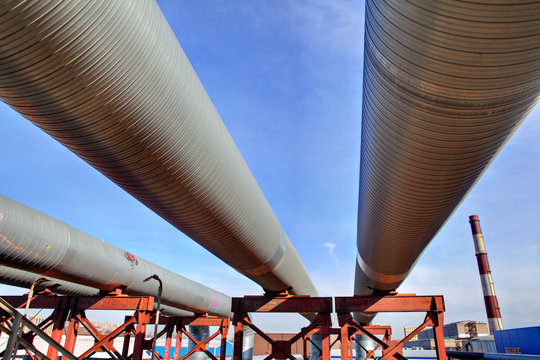 above-ground pipeline, lower shot against blue sky