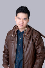 Portrait of asian man wearing jeans shirt amd jacket.