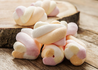 Marshmallows close up on wooden background